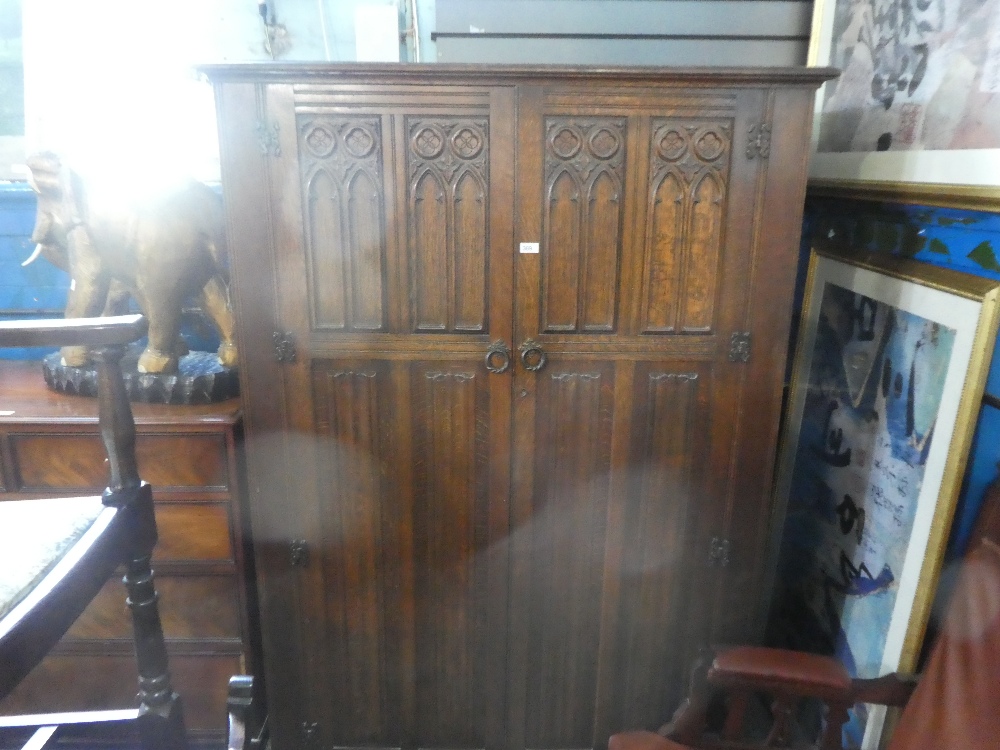 A reproduction oak 2 door wardrobe