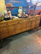 A 1970s Nathan sideboard having 3 drawers with panelled doors below, 183cm