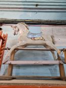 An old rocking horse in need of restoration
