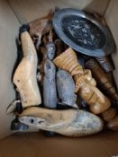 A box of African carved items and sundry