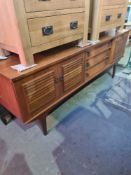 A vintage teak sideboard having 3 drawers with cupboards, 198 cm