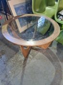 A vintage teak circular coffee table possibly G-Plan with inset glass top, 85cm