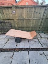 A wooden garden/metal trolley