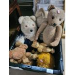 A crate of old cuddly toys, mainly teddies