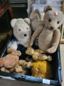 A crate of old cuddly toys, mainly teddies