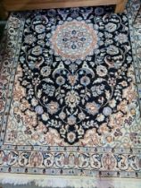Five various rugs including a modern Persian style with floral decoration
