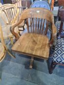 An old oak revolving desk chair