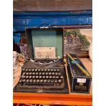 A vintage Imperial typewriter, cased and entitled the Good Companion and a boxed 'Chocogil' champagn