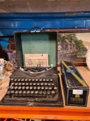 A vintage Imperial typewriter, cased and entitled the Good Companion and a boxed 'Chocogil' champagn