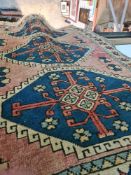 Three modern Caucasian style rugs having geometric designs