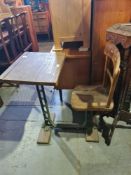 An old school desk having cast iron supports