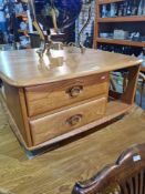 An Ercol light elm Pandoras box square coffee table having 2 drawers, 79cm