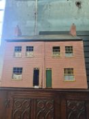 An old Dolls House in the style of two cottages