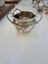 A Victorian silver pretty two handled sugar bowl, and a matching creamer. Having embossed floreated