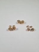 Two pairs of 9ct gold knot design stud earrings, and another circular domed pair, all marked 375, ap
