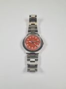 Omega: A 1960s gents stainless steel 'Omega Dynamic' wristwatch with orange dial, date aperture, bat
