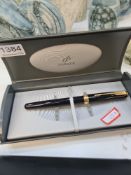A Mont Blanc blank and gold decorated fountain pen in folding leather case and a Parker example in h