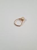Unmarked yellow gold dress ring set with large simulated pearl, size O, approx 2.29g