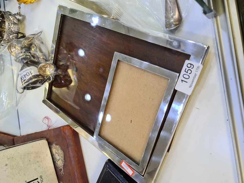 A large silver photo frame by Sanders and Mackenzie, Birmingham 1927, 31.5 x 21.5cm approx. With ano