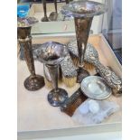 Dressing table items to include silver backed hand brushes, and a comb . Some having decorative embo