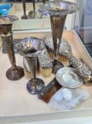 Dressing table items to include silver backed hand brushes, and a comb . Some having decorative embo