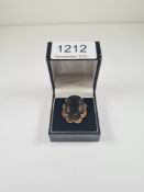 9ct yellow gold cocktail ring with large oval mixed cut smokey topaz, 9ct flower head frame, size O,