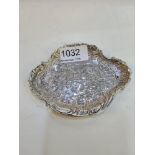A decorative silver Victorian trinket dish, having ornate scene of the country. Hallmarked London 18