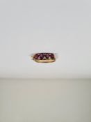 9ct yellow gold dress ring set oval cut rubies, one missing, size O, 2.96g approx, unmarked