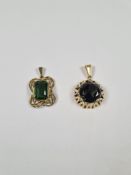 Two 8ct yellow gold green stone set pendants, marked 333