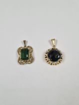 Two 8ct yellow gold green stone set pendants, marked 333