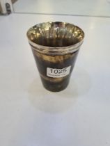 A silver and horn Georgian cup hallmarked London 1821, possibly W E.  A crack in the horn cup. 11cm