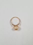 And another unmarked yellow gold dress ring set with large simulated pearl, size O, approx 2.29g