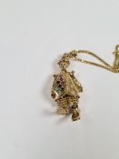 9ct yellow gold curblink neckchain hung with a large pendant in the form of a clown, articulated and