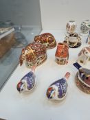 A quantity of Royal Crown Derby paperweights to include an Otter signed by Sue Rowe (11) and other R
