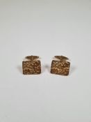 Pair of 9ct yellow gold cufflinks with rectangular panel with raised motif, marked 375, 14.09g appro