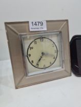 Art Deco easel clock having bevelled glass border and a small travelling leather cased clock