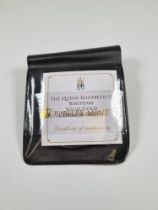 The Jubilee Mint; A 9ct gold commemorative coin, 1g 'The Queen Elizabeth II Birthday' with Certifica