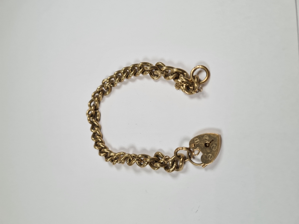 9ct yellow gold curb link bracelet with heart shaped clasp and safety chain, AF, marked 375, approx