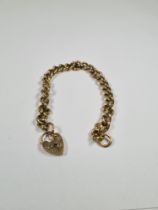 9ct yellow gold curb link bracelet with heart shaped clasp and safety chain, AF, marked 375, approx
