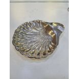 A very large silver shell dish having three ball feet. A decorative piece by Atkin Brothers, Sheffie
