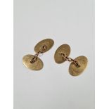 Pair of oval 9ct gold cufflinks, with machined decoration, marked 375, HG & S, approx 6.64g