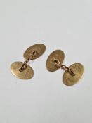 Pair of oval 9ct gold cufflinks, with machined decoration, marked 375, HG & S, approx 6.64g