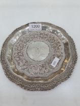 A Ceylonese tray, Sri Lanka, of circular form, having repoussed, pretty design. Highly decorative bo