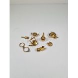 A selection of 9ct gold charms, 8, to include kettle, boot, horseshoe, fish with a pearl in mouth, r