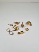 A selection of 9ct gold charms, 8, to include kettle, boot, horseshoe, fish with a pearl in mouth, r