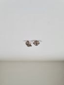 Pair of 9ct white gold diamond stud earrings, each approx 0.17 carat marked 375, with butterfly back
