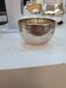 A silver Victorian salt/small cup having engraved floreated details and patterned border body. A dec