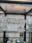 An antique wine glass having overlaid white swirl decoration and other glassware to include a set of