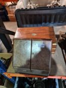 An antique desk slope on sloping stationery box and a hanging gone