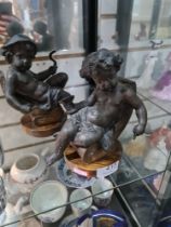 A pair of bronze style spelter cherubs on wooden base, 18cm